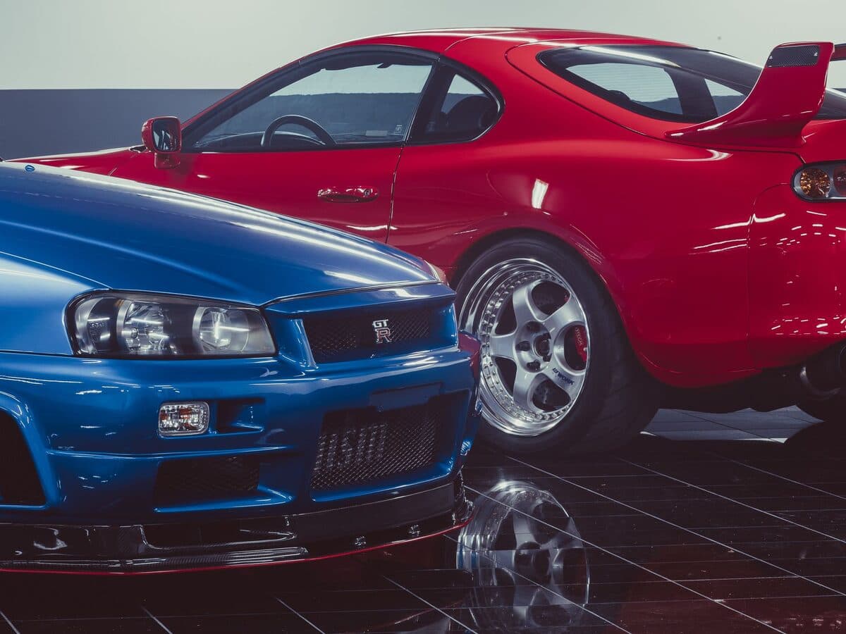 Two Japanese performance coupés parked front to front
